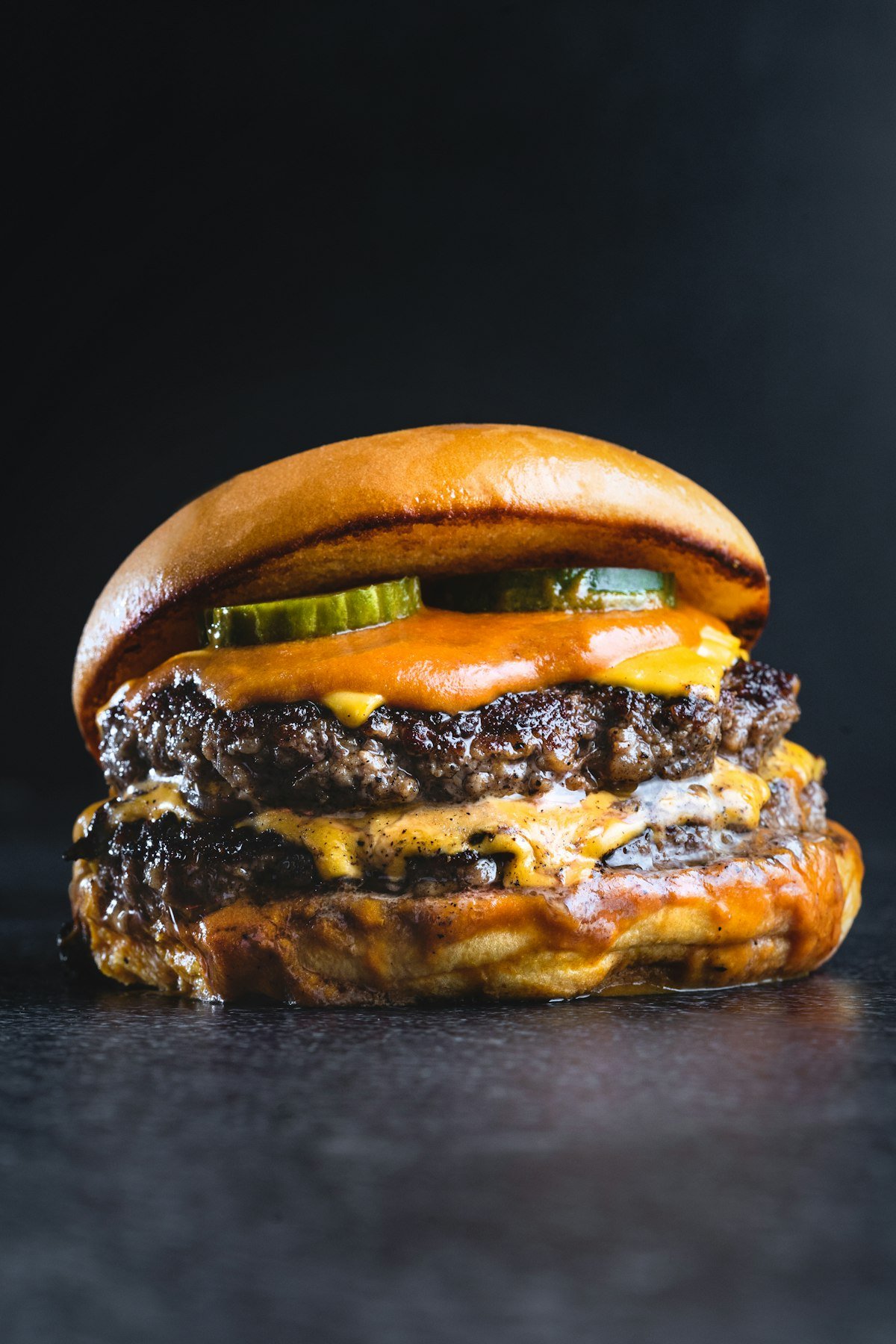 Close-up of melted cheese on a burger patty